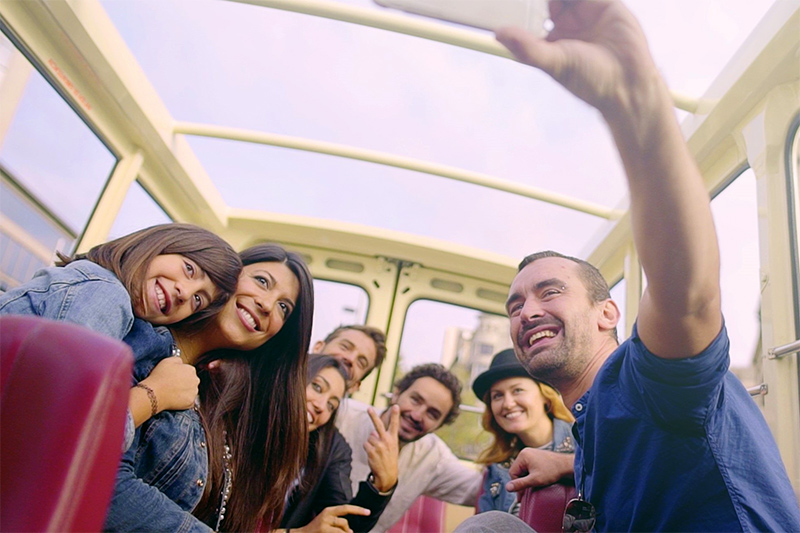 group taking a selfie with tour guide