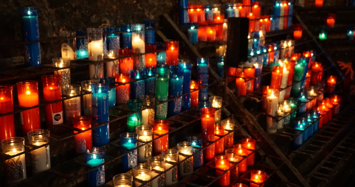 The lit up candles at the Ave Maria path, exiting the Montserrat basilica.