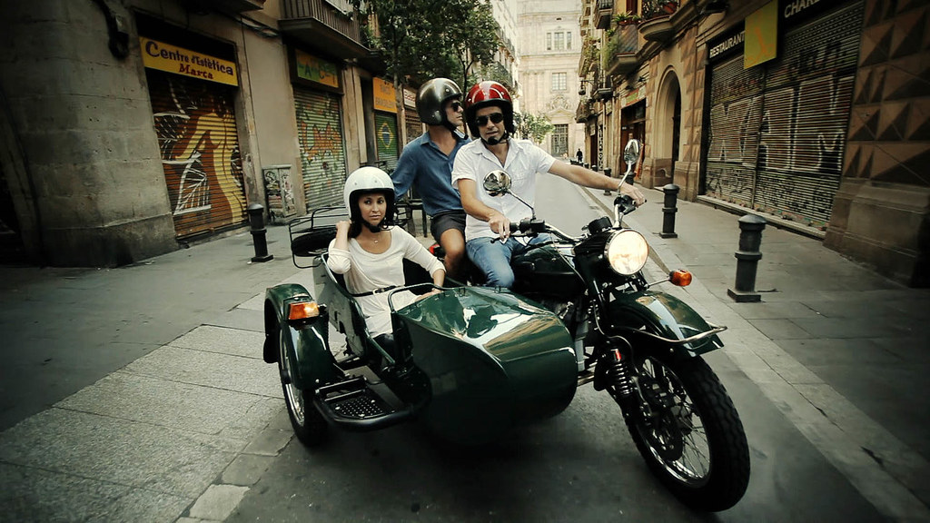 Couple taking a private tour by sidecar motorcycle with BrightSide Tours local guide.