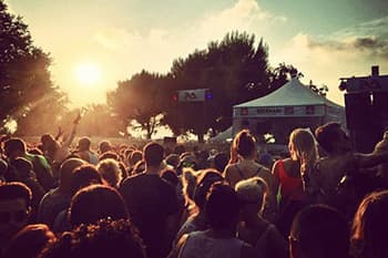 crowd in a outdoor concert in the afternoon